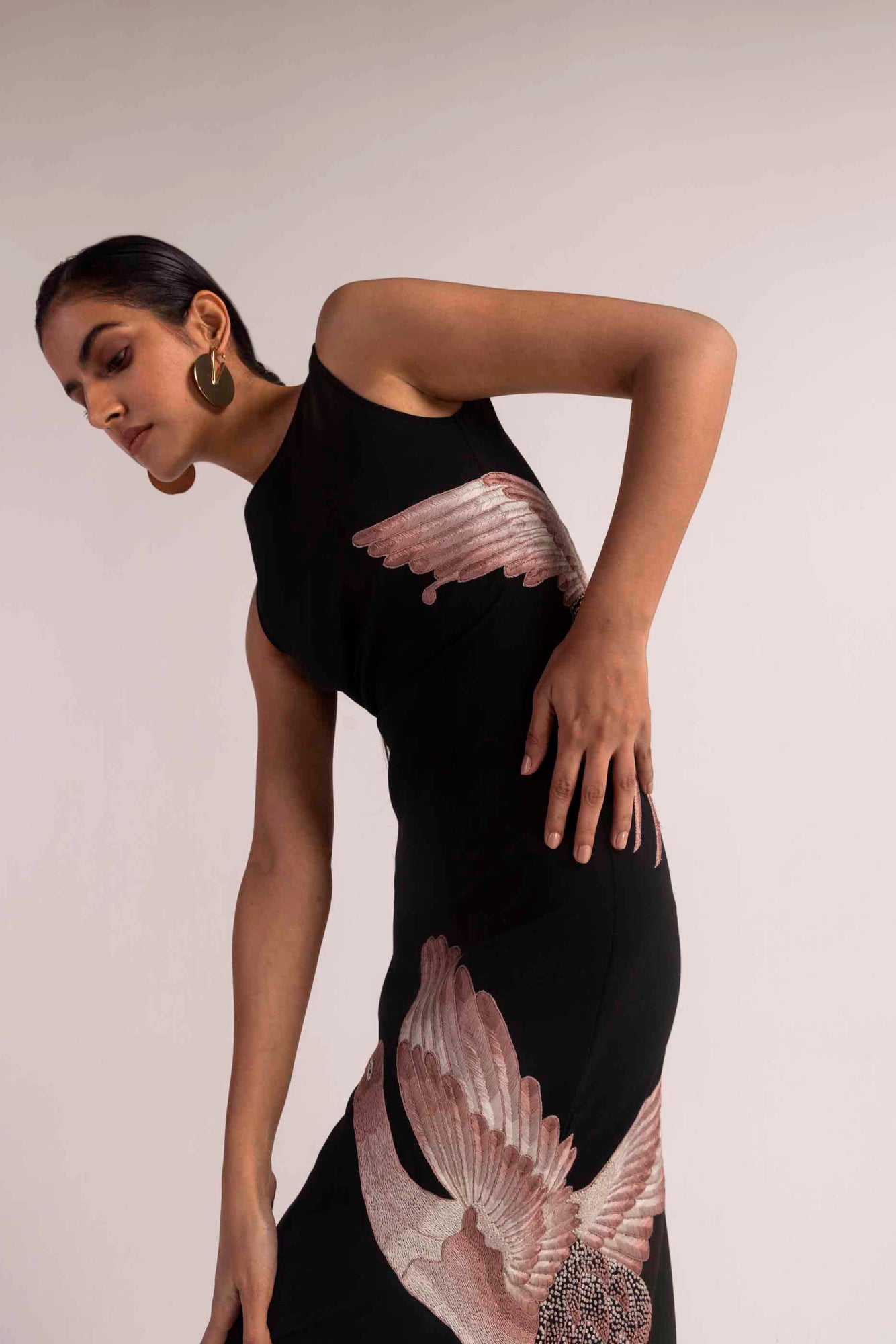 Dark ember dress in rich hues, showcasing intricate hand embroidery on premium handloom fabric, epitomizing luxury womenswear