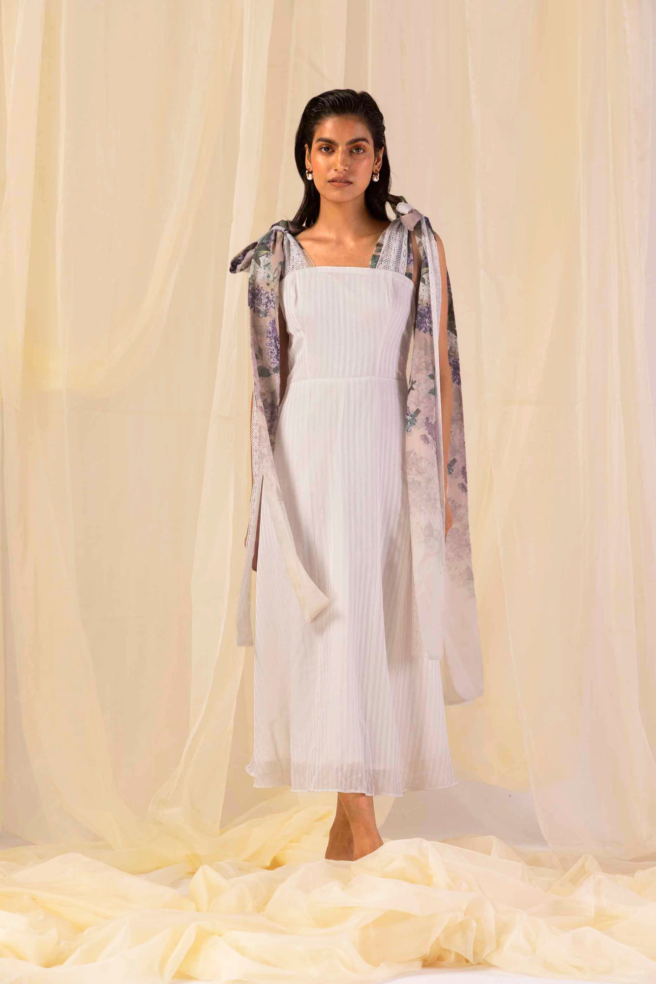 Elegant flared dress in vibrant hydra hues, showcasing artisan handloom stripes and premium fabric, epitomizing luxury womenswear