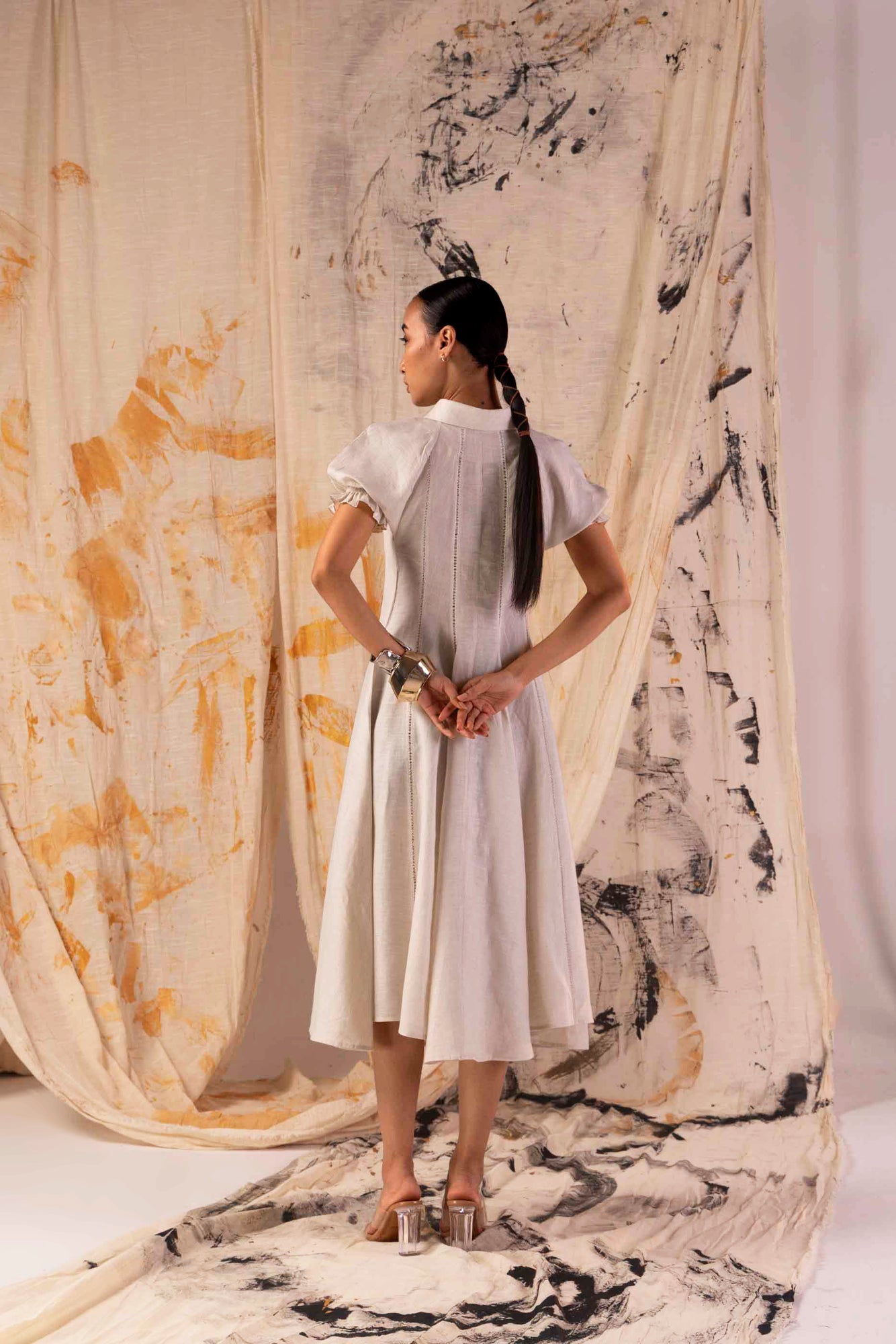Side view of Sandlace Linen Dress in premium handloom fabric, showcasing its elegant silhouette and artisan craftsmanship, luxury womenswear