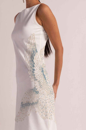 Elegant sea-shell pearl dress in premium handloom fabric, showcasing a flowing silhouette and artisan craftsmanship, perfect for luxury womenswear