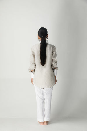 Close-up of the handloom fabric on the Brick Moon Shirt, showcasing its intricate weave and luxurious texture, epitomizing artisan craftsmanship