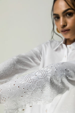 Milky-white handcrafted shirt in premium fabric, showcasing luxury womenswear style with elegant silhouette and artisan details