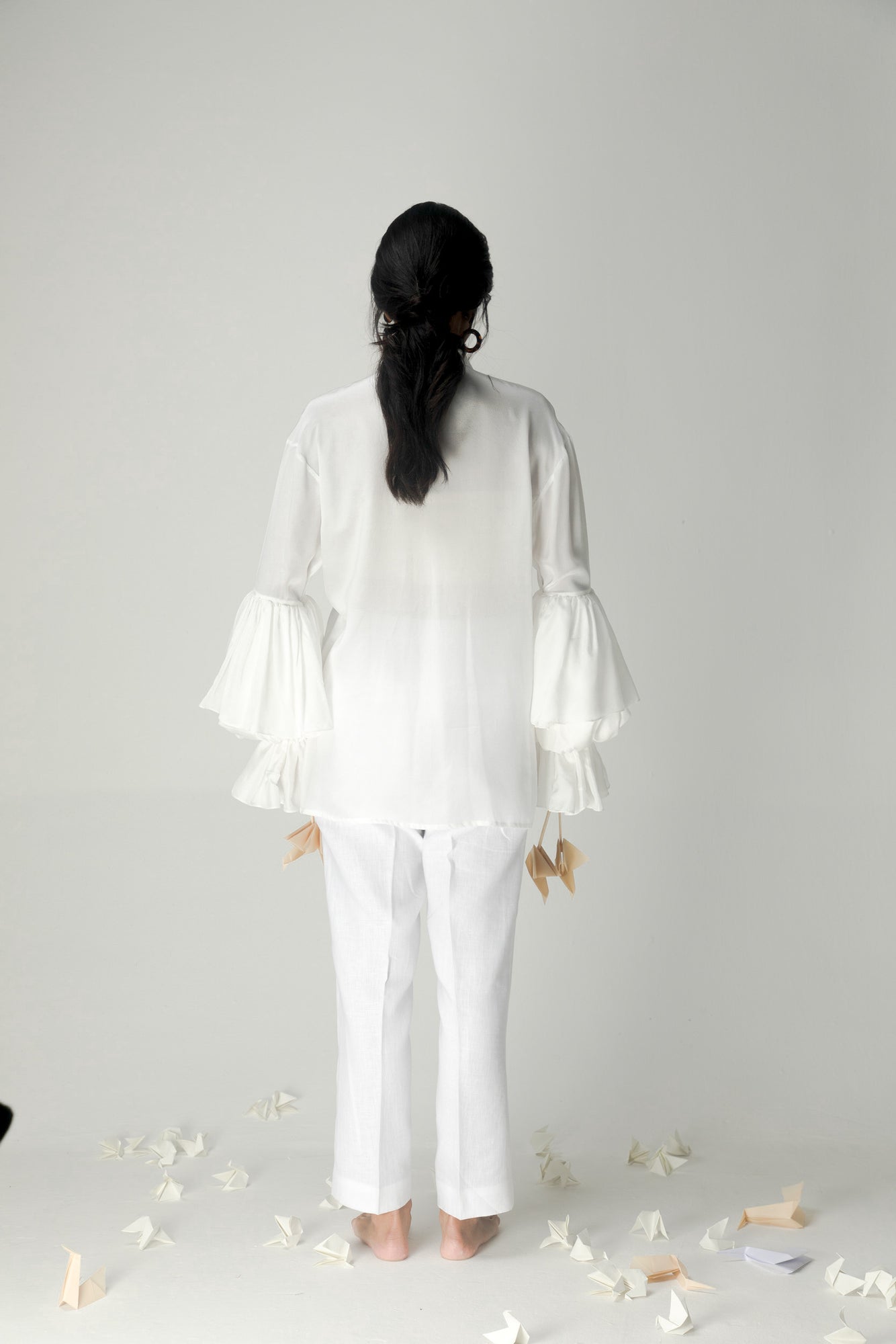 "Elegant handloom garlic shirt in premium fabric, showcasing NJ3 Atelier's luxury womenswear with a refined silhouette and artisan craftsmanship."