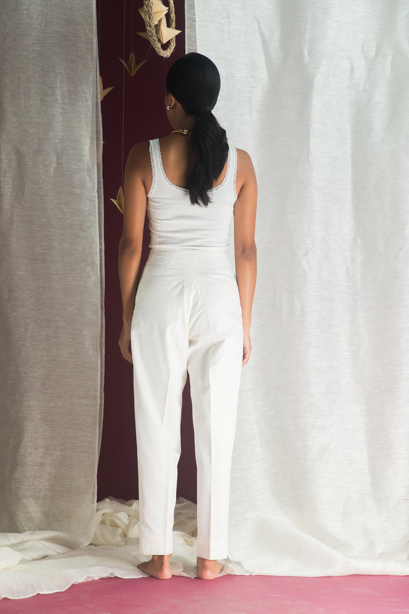 Handcrafted luxury womenswear trousers in premium handloom fabric, showcasing a refined silhouette and exquisite artisan craftsmanship