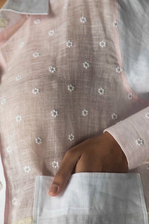 Close-up of the handcrafted white shirt with intricate handloom patterns, showcasing NJ3 Atelier's luxury artisan-made womenswear