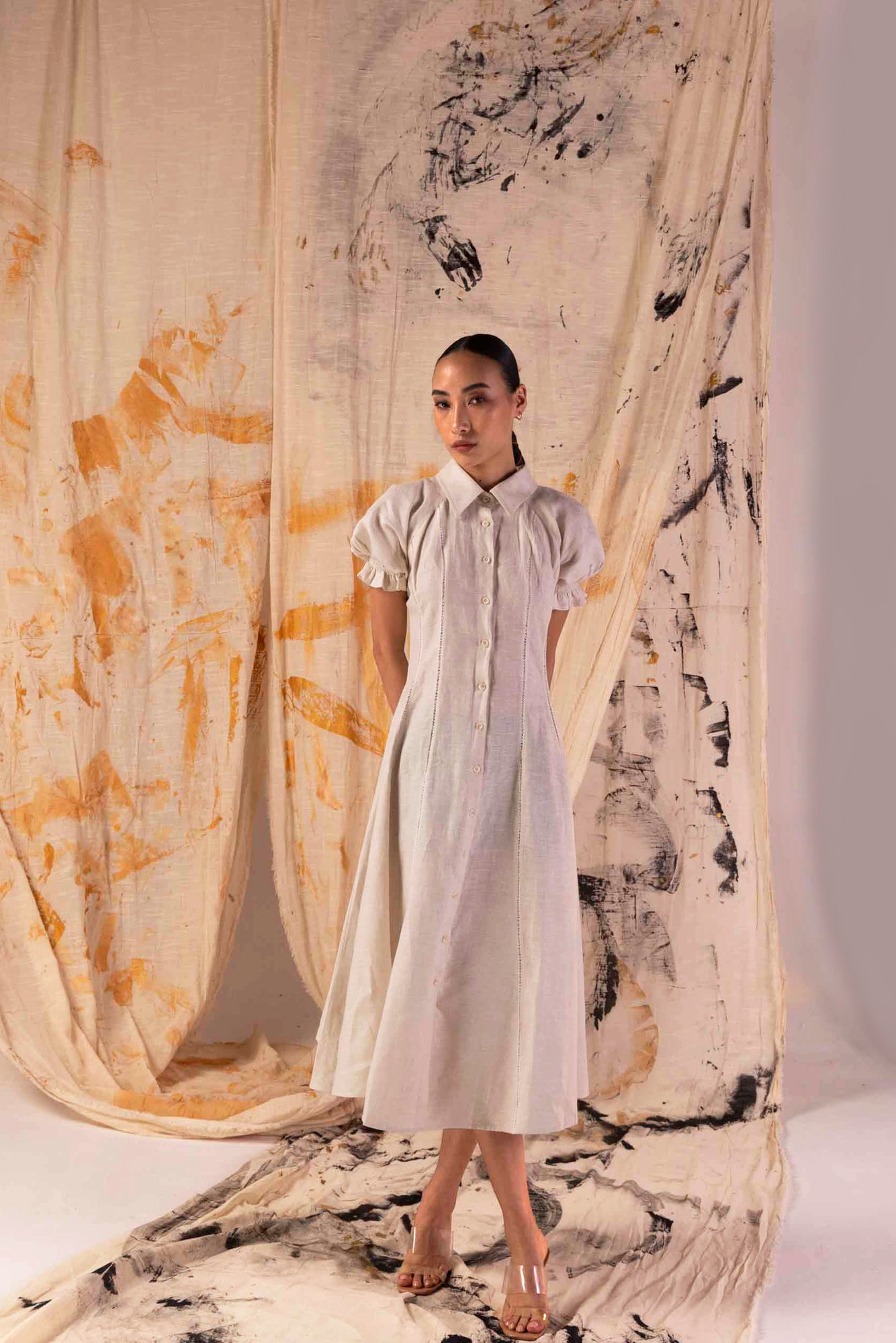 Elegant Sandlace Linen Dress in soft beige, showcasing handcrafted details and premium fabric, epitomizing luxury womenswear