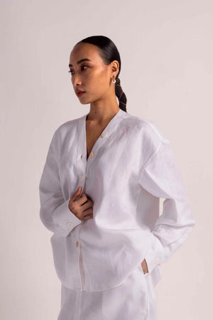Elegant handloom white coord set with premium fabric, showcasing a tailored silhouette, epitomizing luxury womenswear craftsmanship