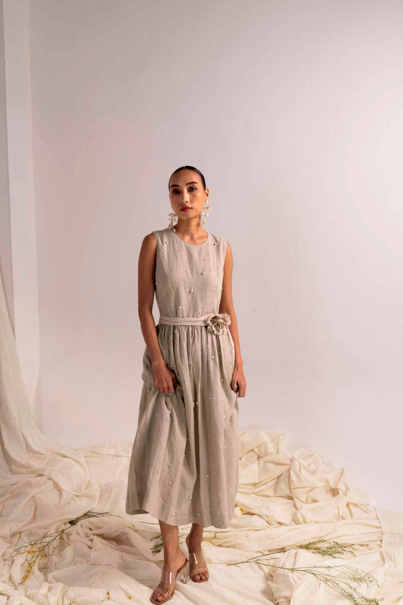 Elegant silhouette of the Pearl Perle linen dress in soft ivory, showcasing artisan handloom craftsmanship and luxury womenswear design