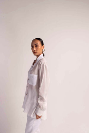 Elegant Valencia Tuck Shirt in soft handloom fabric, showcasing a refined silhouette and artisan craftsmanship for luxury womenswear