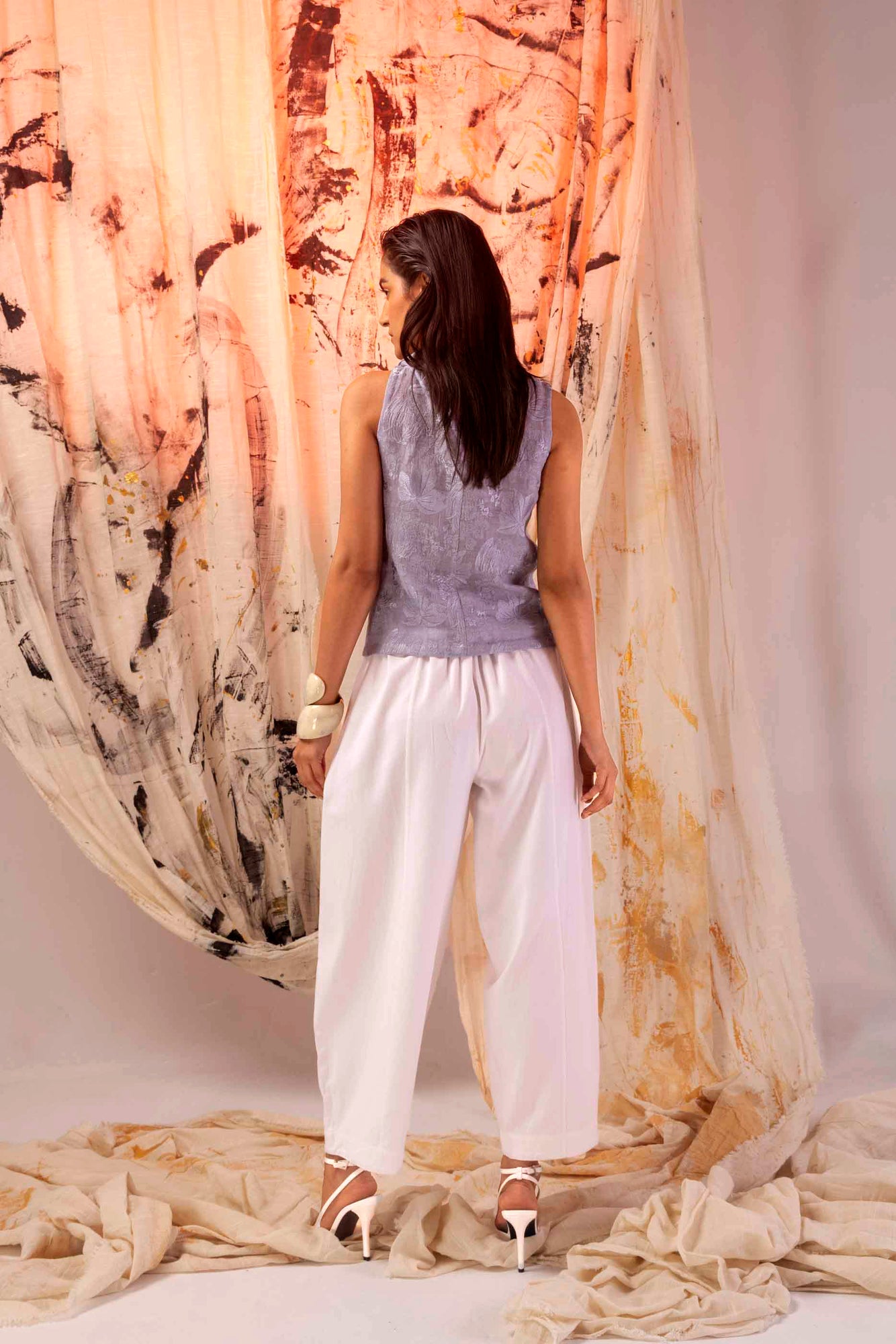 Luxurious handloom alpine white trousers showcasing premium fabric and artisan craftsmanship, epitomizing NJ3 Atelier's elegant style