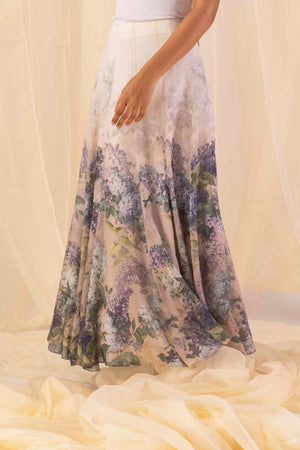 Close-up of the handloomed hydra-hues flow skirt, showcasing its luxurious drape and intricate artisan-crafted patterns in vibrant tones