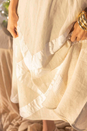 Handcrafted almond beige skirt in premium fabric, showcasing a luxurious silhouette with artisan detailing, epitomizing NJ3 Atelier elegance