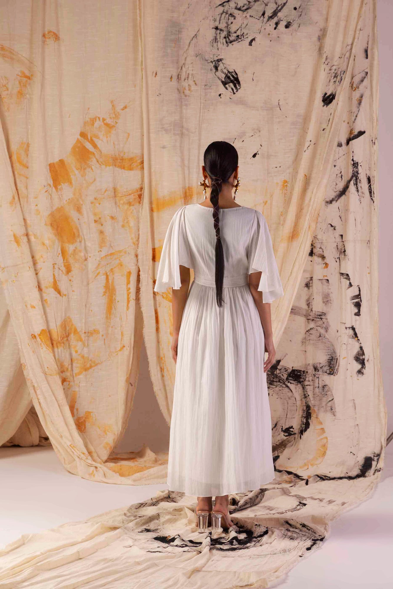Elegant Valencia Fluid Dress in handloom silk, showcasing a flowing silhouette with artisan-crafted details, epitomizing luxury womenswear