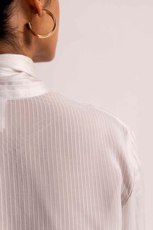 Elegant Valencia Drape Shirt in soft handloom fabric, showcasing a flowing silhouette and exquisite craftsmanship, epitomizing luxury womenswear