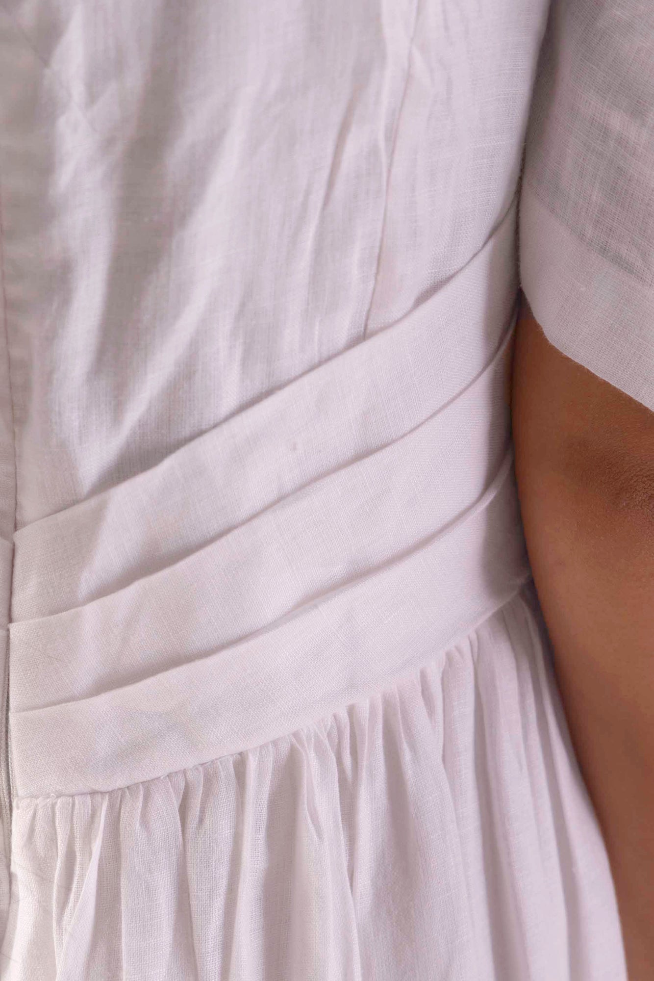 Elegant paper-white linen dress with delicate button detailing, showcasing NJ3 Atelier's handcrafted luxury womenswear craftsmanship