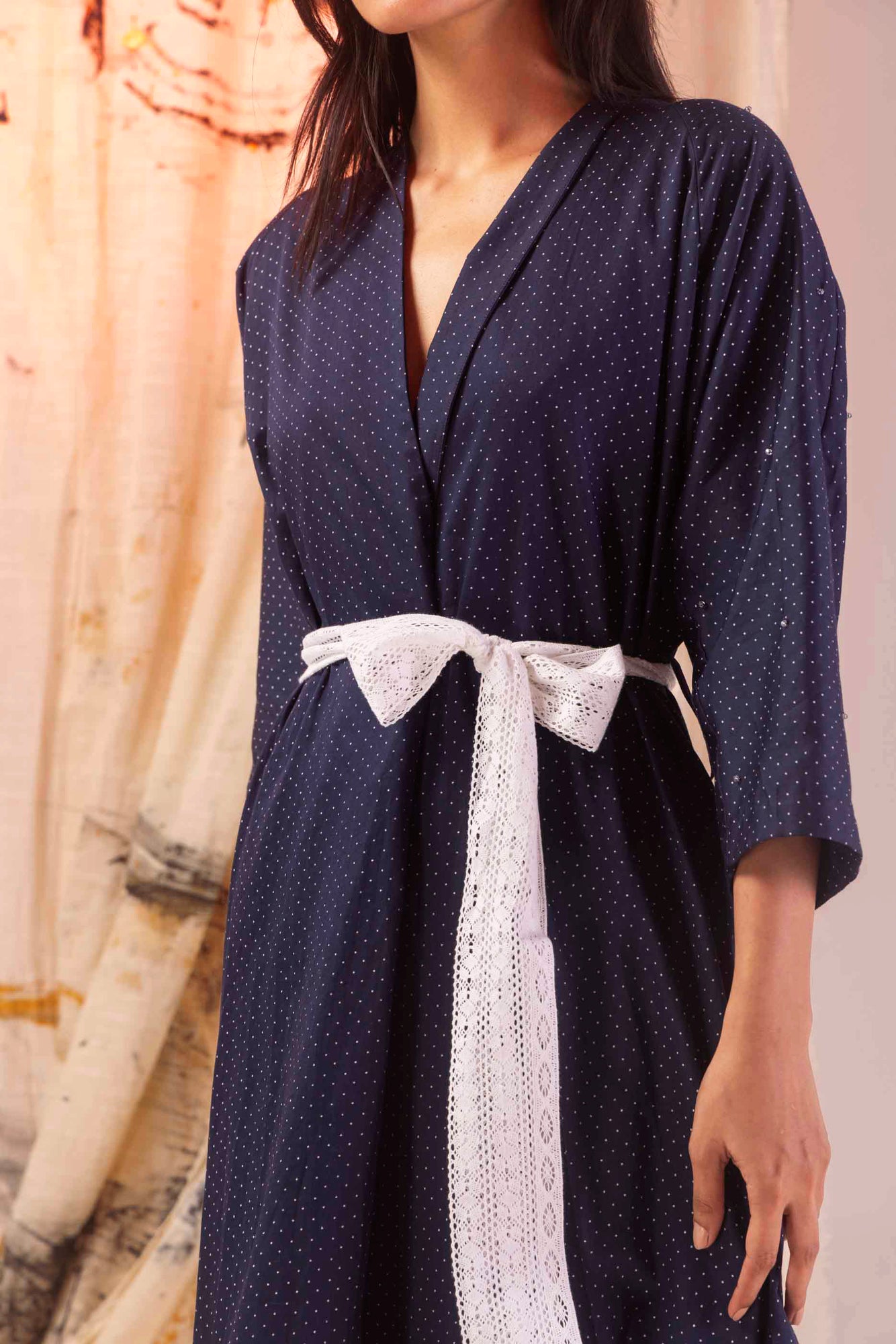 Azure satin dress with elegant dot pattern, showcasing a luxurious silhouette and premium handloom craftsmanship, perfect for upscale occasions