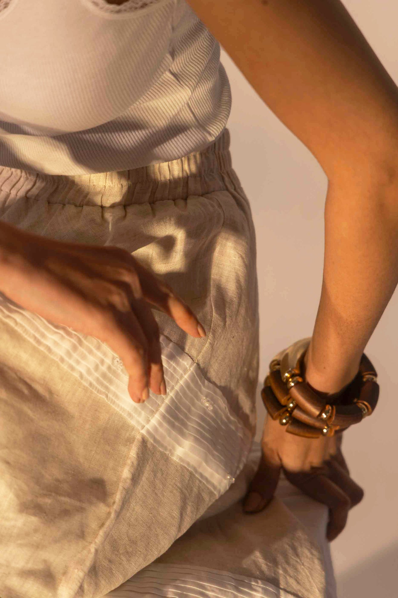 Elegant almond beige skirt in premium fabric, showcasing artisan craftsmanship and luxurious handloom texture, ideal for upscale womenswear