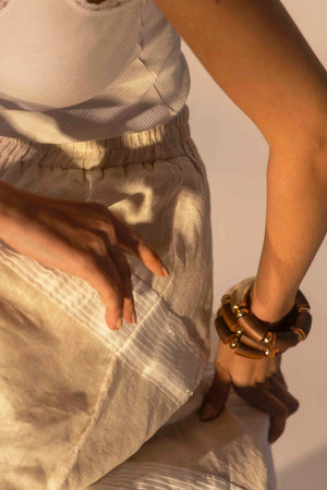 Elegant almond beige skirt in premium fabric, showcasing artisan craftsmanship and luxurious handloom texture, ideal for upscale womenswear