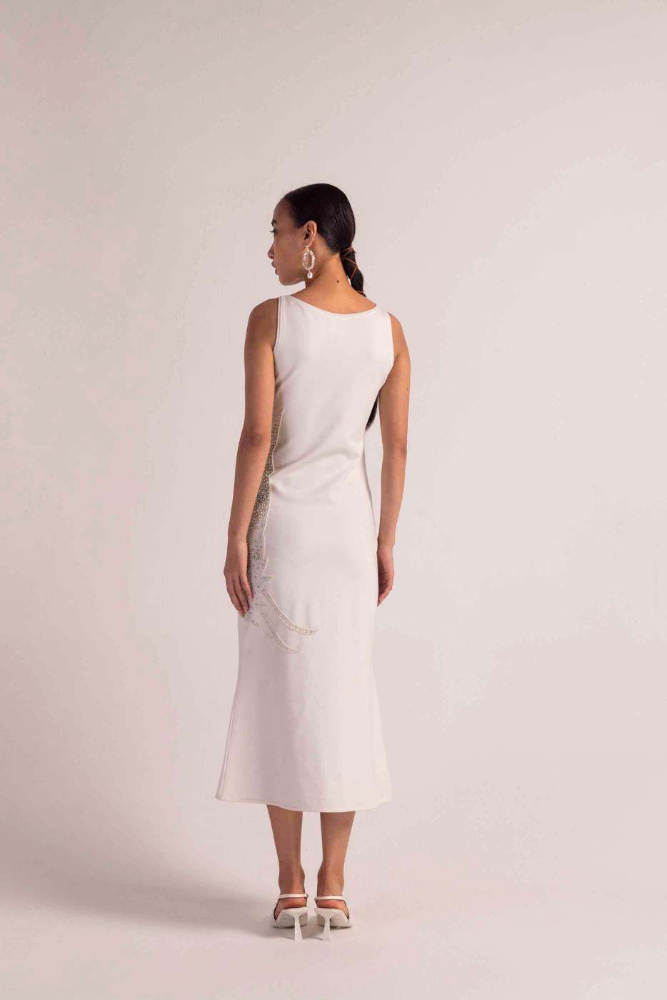 Close-up of the sea-shell pearl dress, showcasing its luxurious handloom fabric and intricate artisan craftsmanship