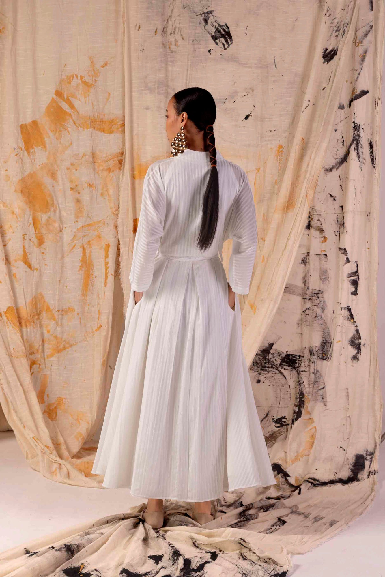 Elegant handloom Valencia dress in premium fabric, showcasing intricate lace stripes, epitomizing luxury womenswear craftsmanship
