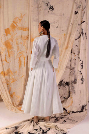 Elegant handloom Valencia dress in premium fabric, showcasing intricate lace stripes, epitomizing luxury womenswear craftsmanship