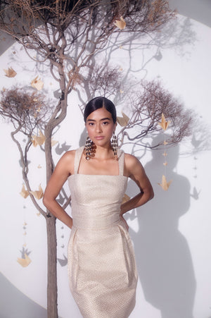 Rose gold slip dress in golden silk jacquard with cotton lurex, showcasing a luxurious, handcrafted silhouette, perfect for elegant occasions