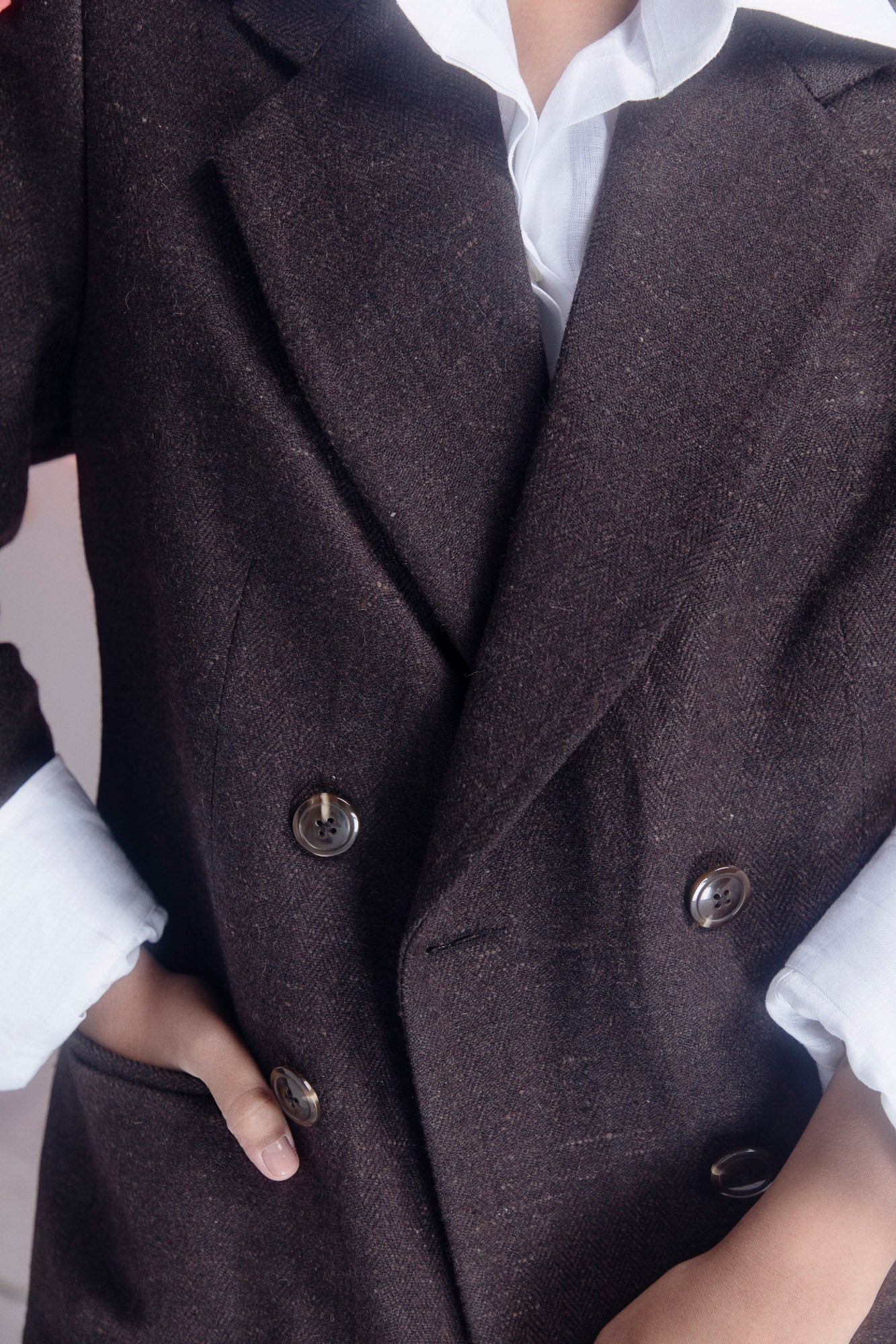 Luxurious brown blazer in premium handloom fabric, showcasing elegant silhouette and artisan craftsmanship, perfect for sophisticated womenswear