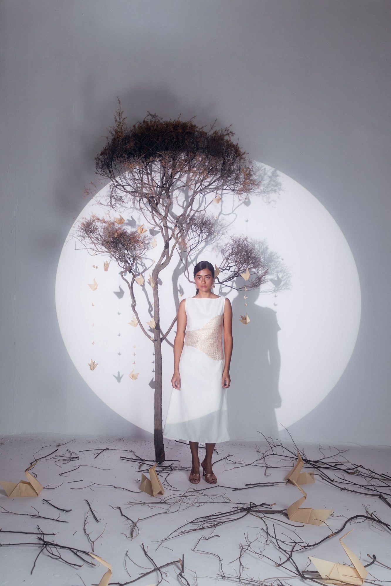 Butter-white silk dress showcasing a flowing silhouette, handcrafted from premium silk, epitomizing luxury womenswear by NJ3 Atelier