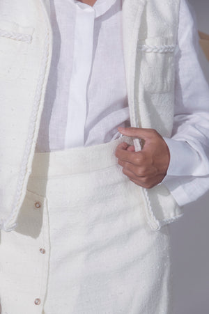 Elegant pearl-white jacket crafted from premium handloom fabric, showcasing a tailored silhouette and exquisite artisan detailing