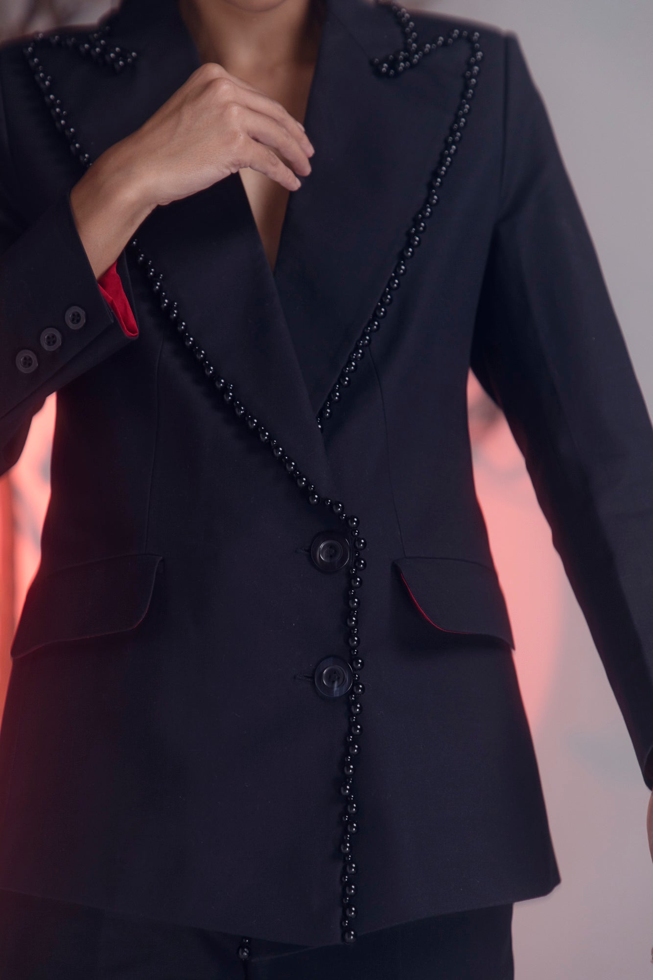 Jet-black pearl suit in premium handloom fabric, showcasing exquisite craftsmanship and luxury womenswear elegance by NJ3 Atelier