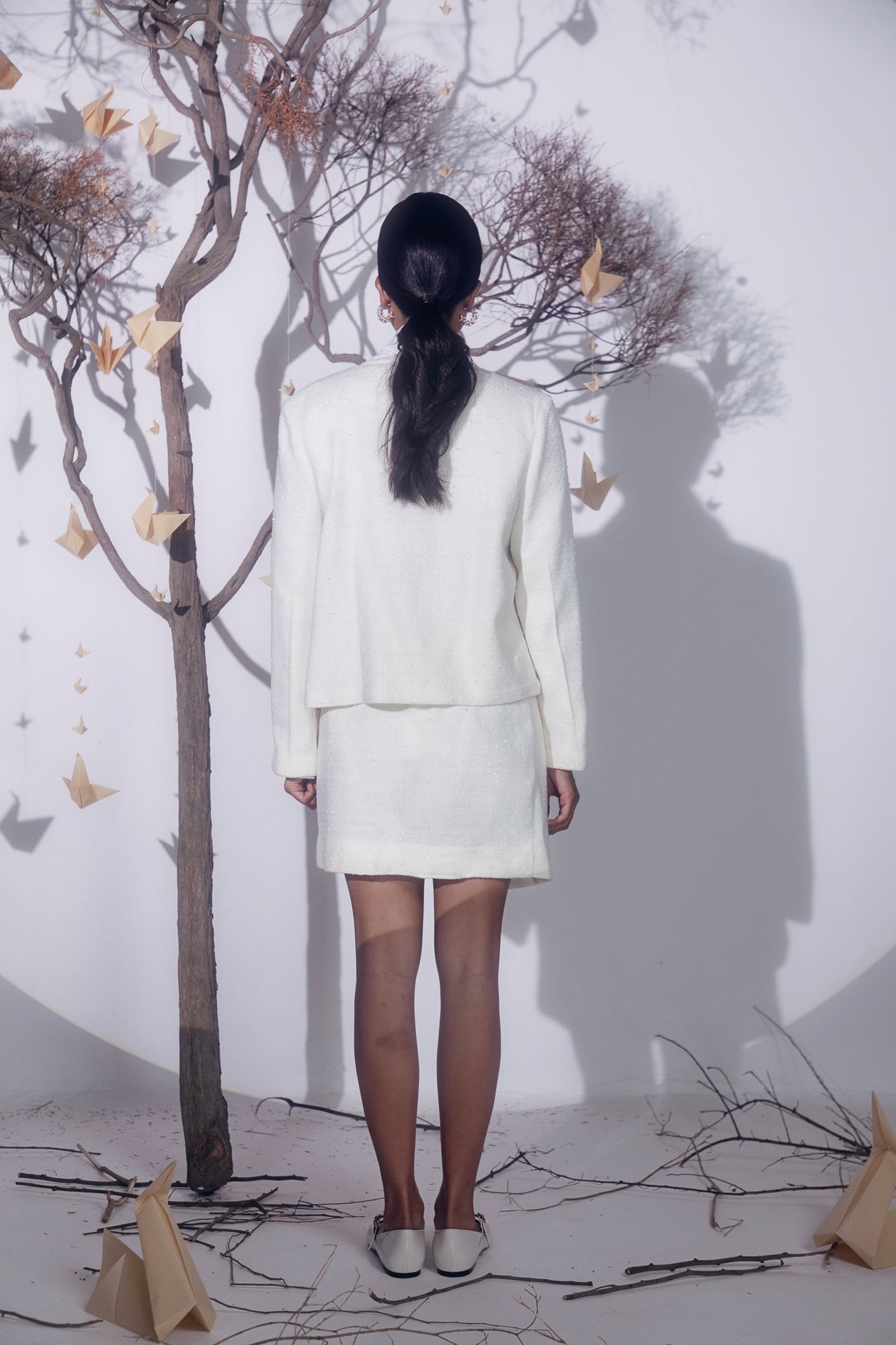 Elegant lace white jacket in premium fabric, showcasing intricate handloom craftsmanship, tailored for luxury womenswear by NJ3 Atelier