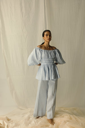 Elegant side profile of handcrafted Largo Sky Chiaro trousers, showcasing premium handloom fabric and luxurious tailoring