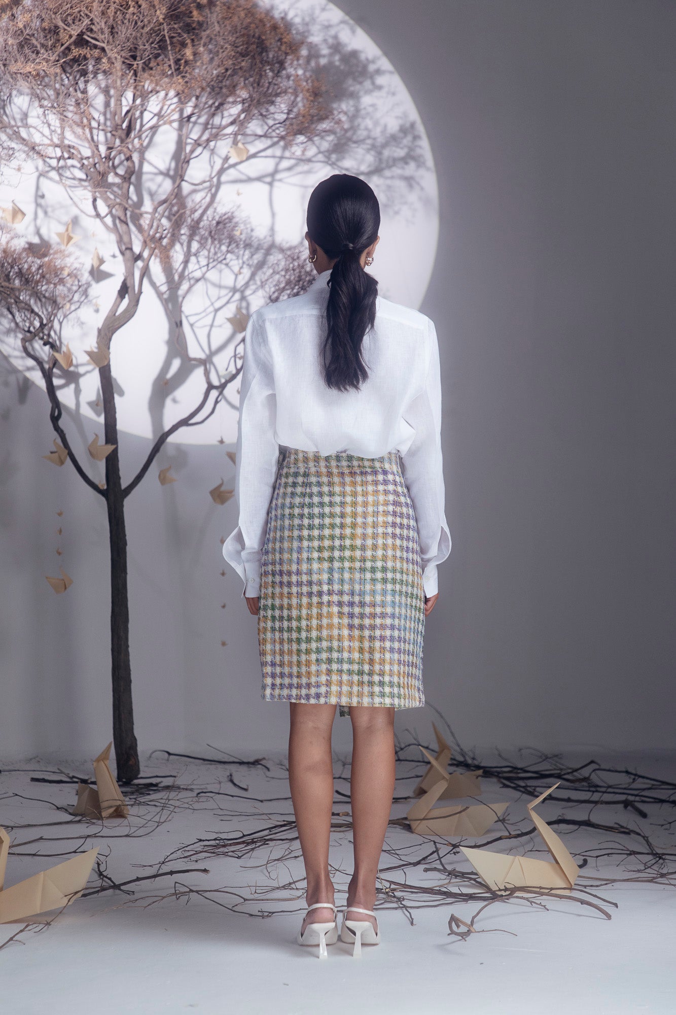 Elegant clay pencil skirt in premium handloom fabric, showcasing a sleek silhouette and refined craftsmanship for luxury womenswear