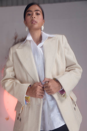 Handcrafted marbel-felt blazer in rich charcoal, showcasing intricate stitching and tailored silhouette, epitome of luxury womenswear