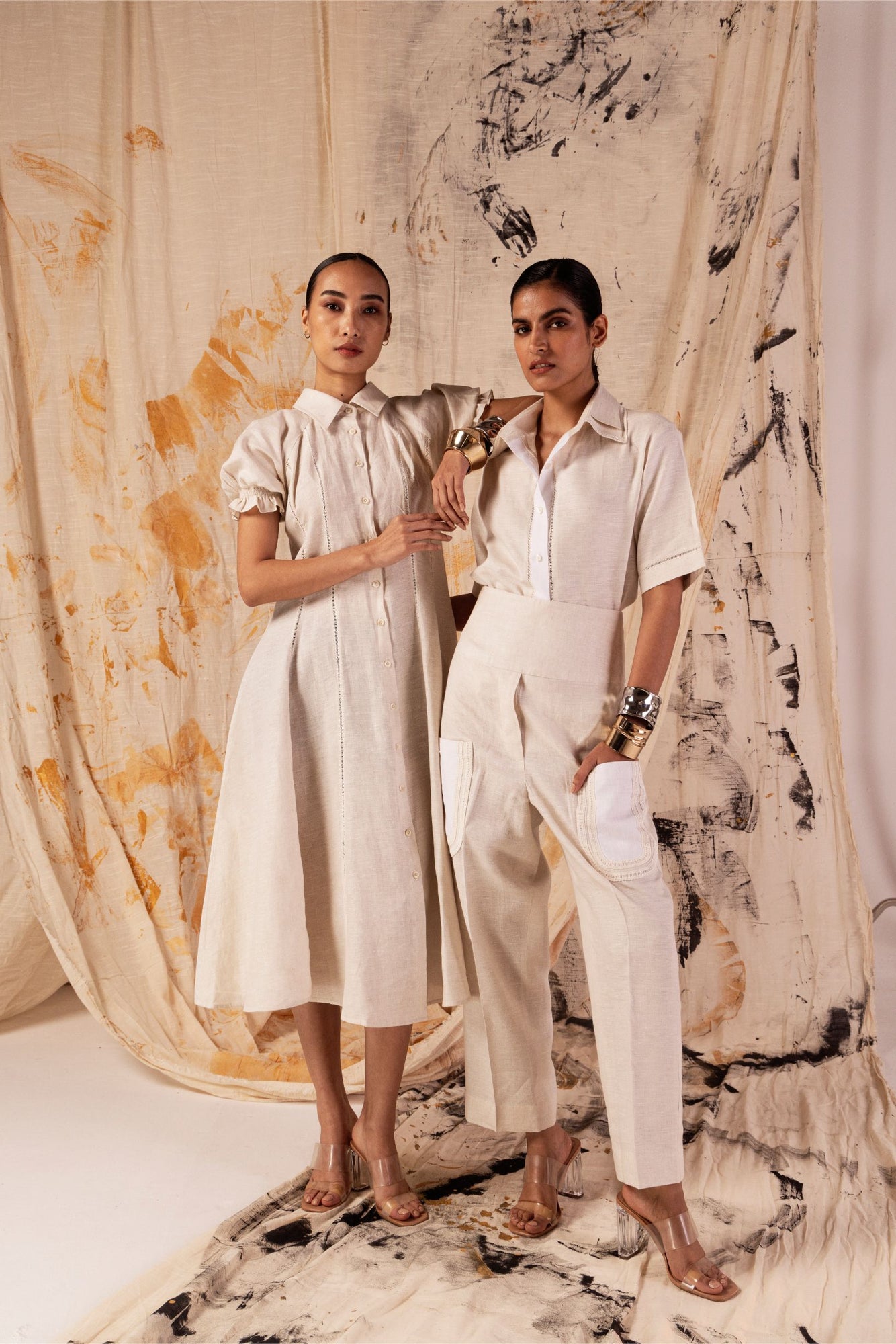 Beige linen dress with classic collar, lace seams, puff sleeves, and A-line silhouette; handcrafted luxury womenswear made in India