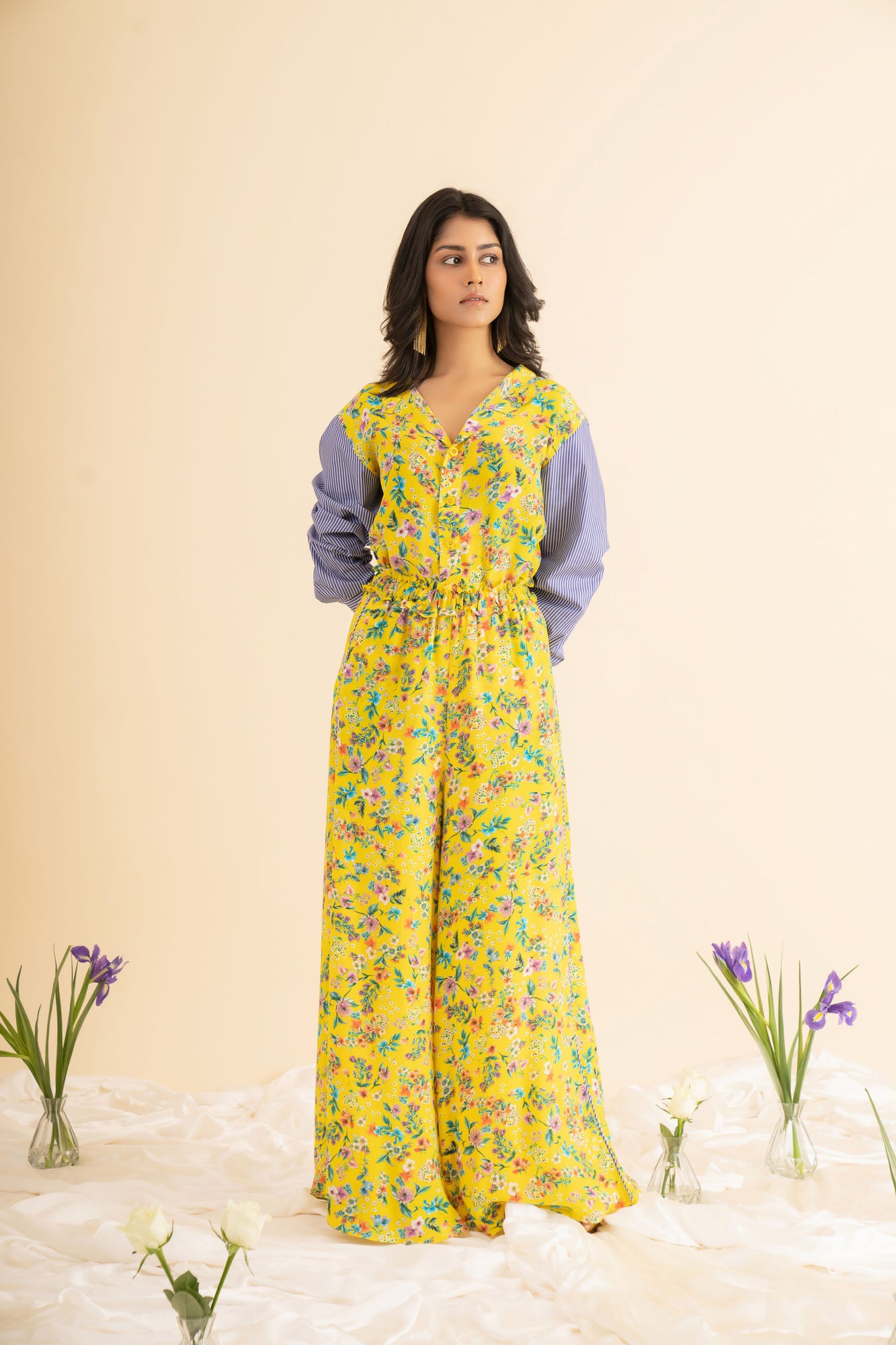 Luxurious yellow floral printed crepe silk palazzo pants with waist ruffle, showcasing premium artisan craftsmanship and elegant design
