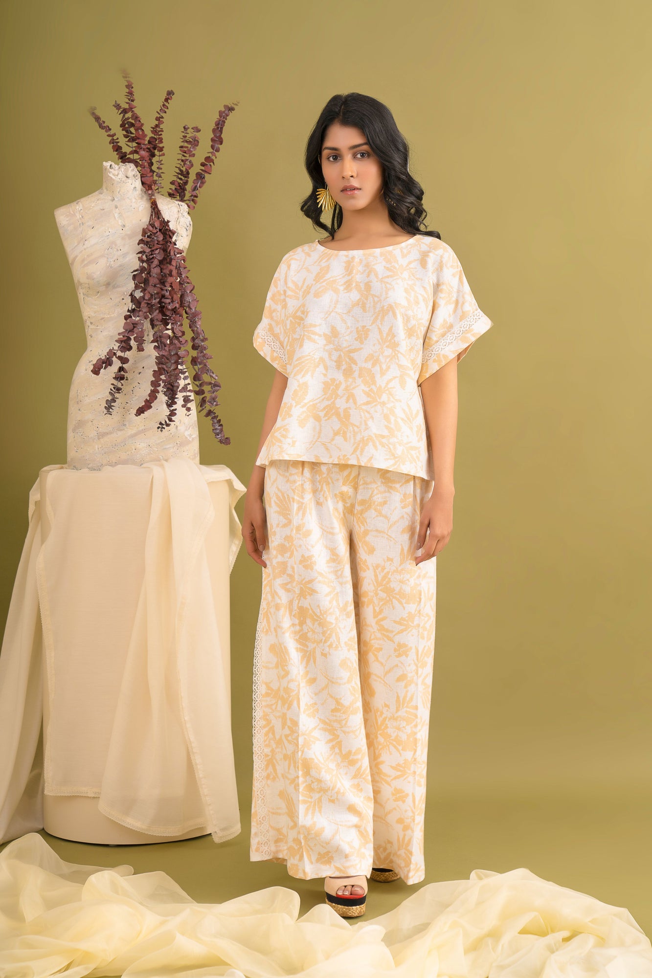 Luxurious beige linen co-ord set with floral print, featuring a dolman top and trousers, artisan-crafted with delicate lace detailing