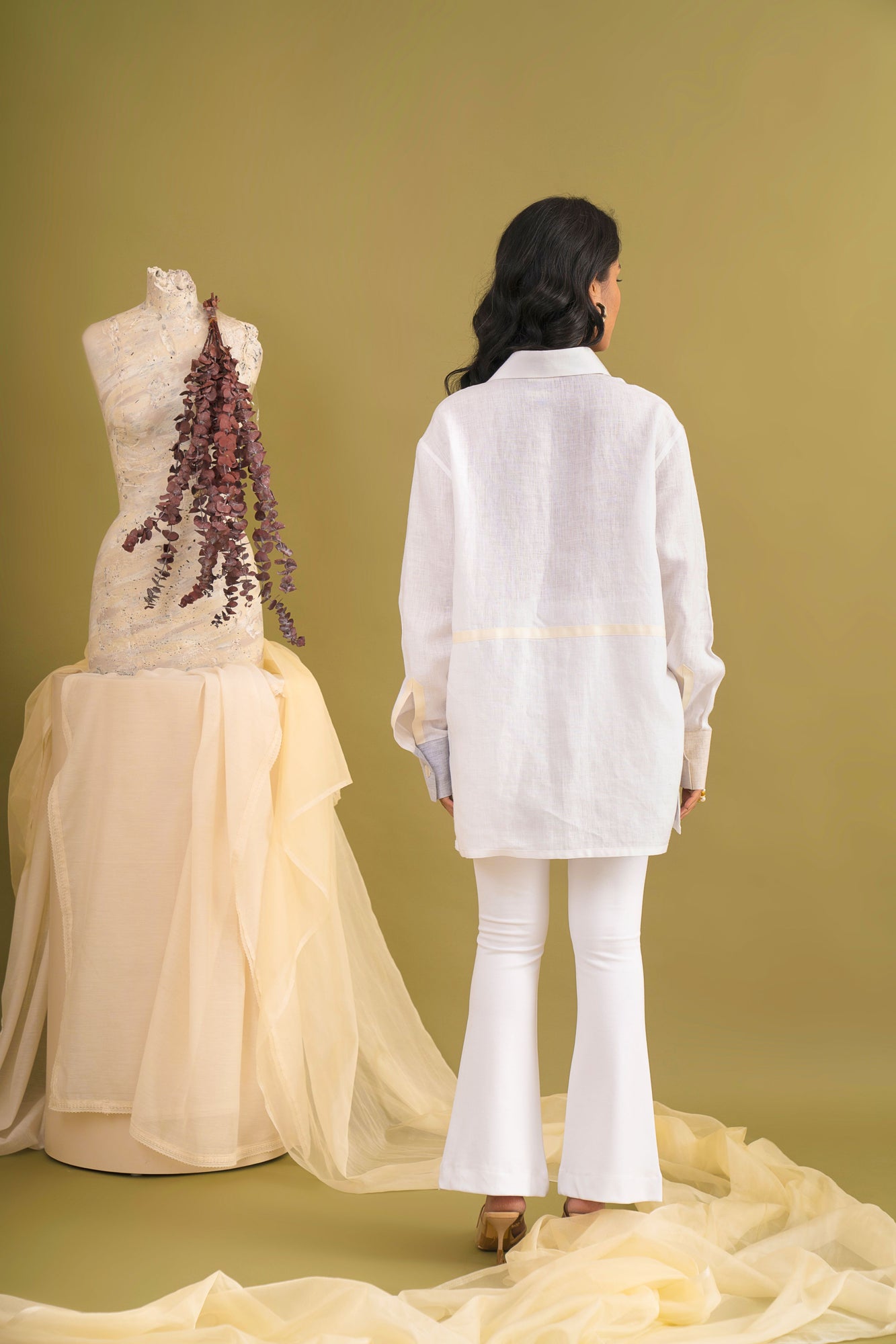 Handcrafted luxury womenswear shirt in vibrant hues, featuring premium handloom fabric and a unique artisan silhouette
