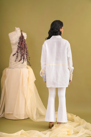 Handcrafted luxury womenswear shirt in vibrant hues, featuring premium handloom fabric and a unique artisan silhouette