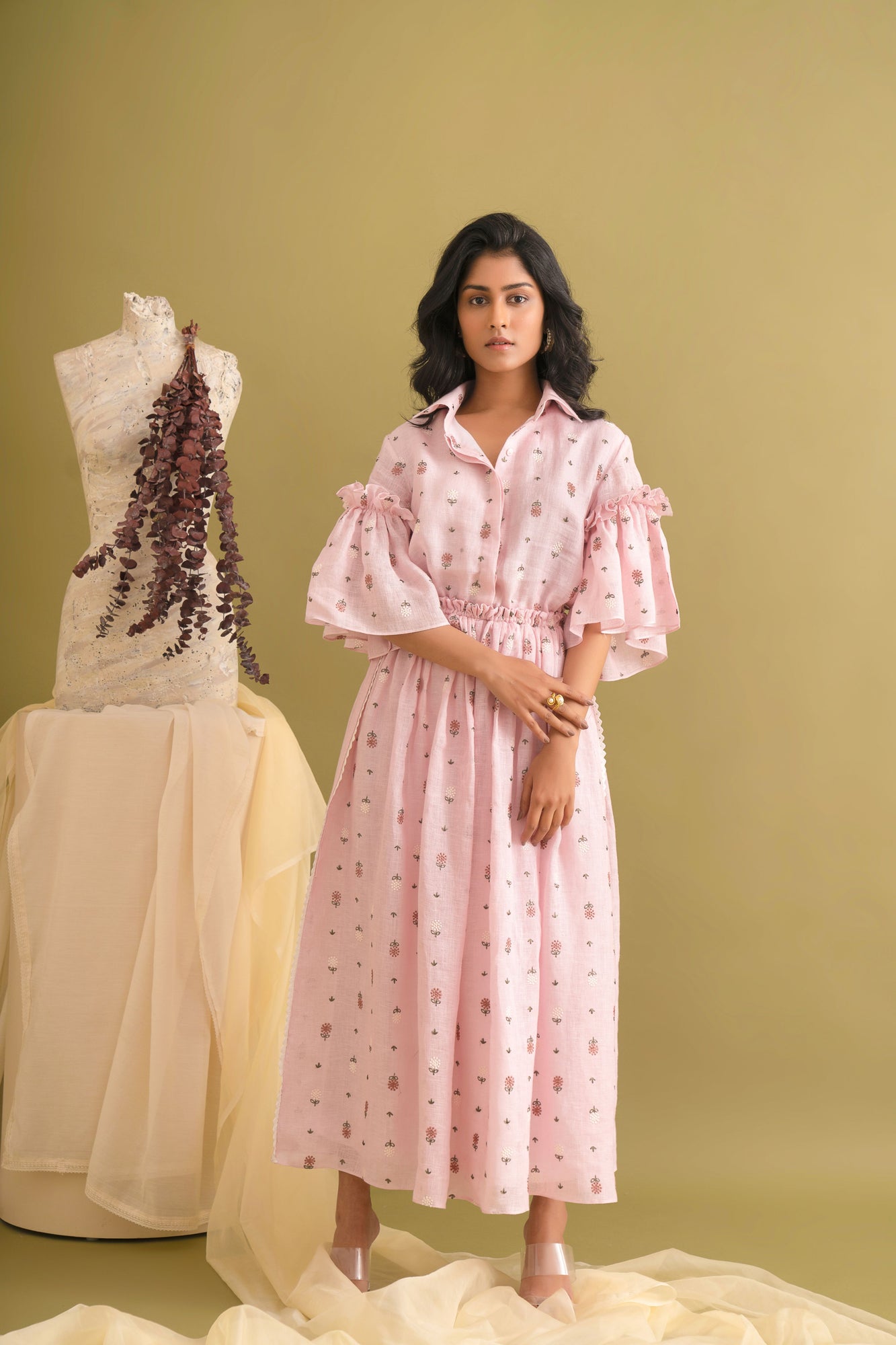 Elegant pink coral dress in premium handloom fabric, showcasing a flowing silhouette and exquisite craftsmanship, epitomizing luxury womenswear
