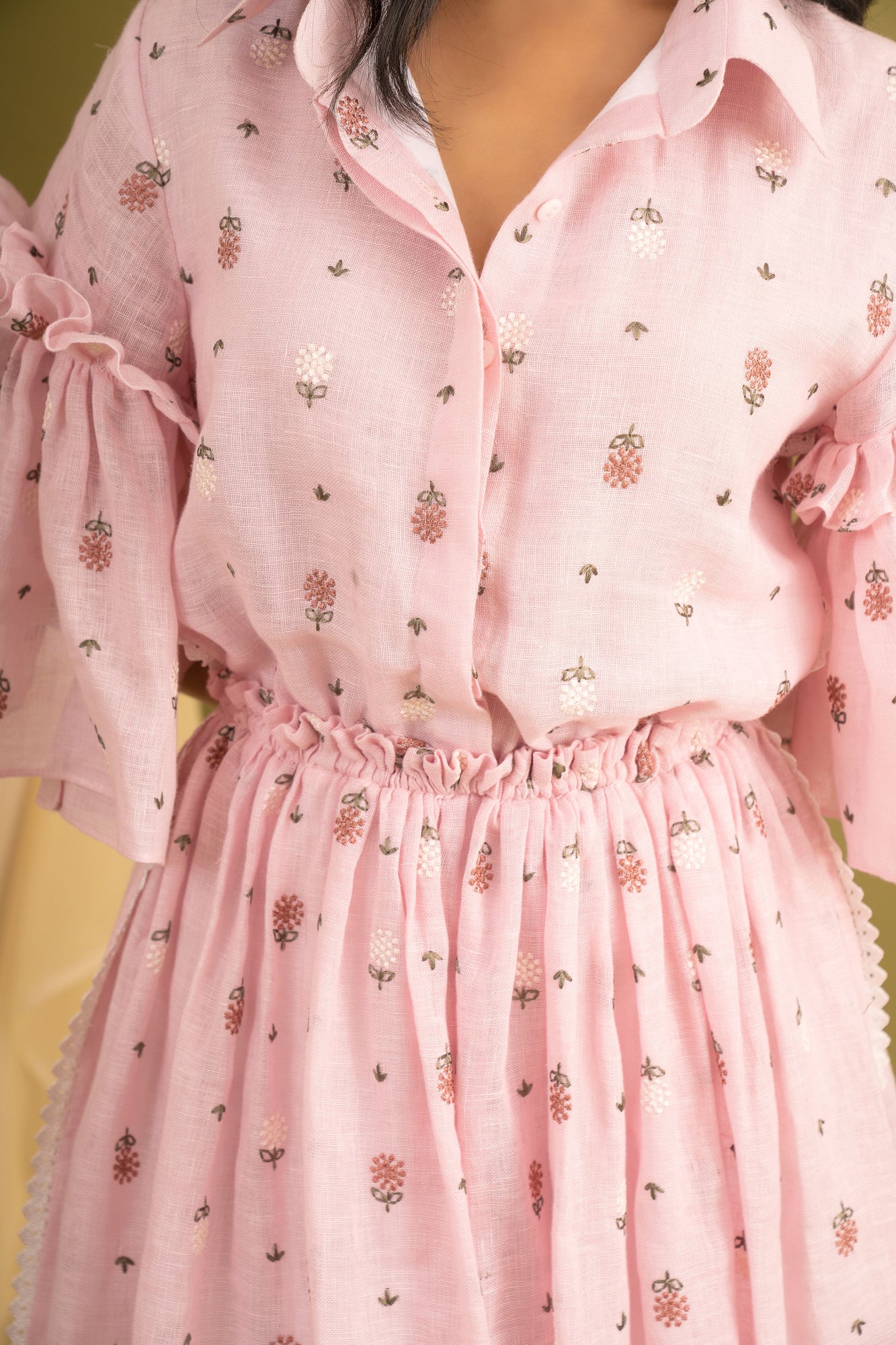 Elegant pink coral dress in luxurious handloom fabric, showcasing a sophisticated silhouette perfect for high-end occasions