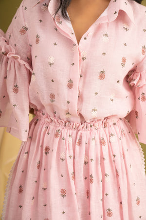 Elegant pink coral dress in luxurious handloom fabric, showcasing a sophisticated silhouette perfect for high-end occasions