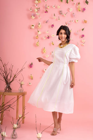 White linen midi dress with green neon tape, showcasing a handcrafted, artisan-made silhouette, epitomizing luxury womenswear