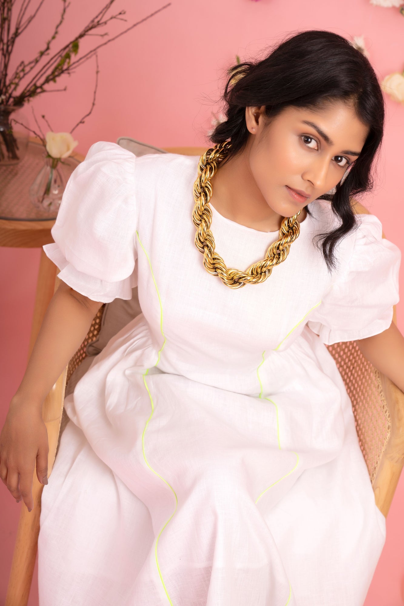 Elegant handloom midi dress in soft pastel hues, showcasing a flowing silhouette and intricate artisan detailing, epitomizing luxury womenswear