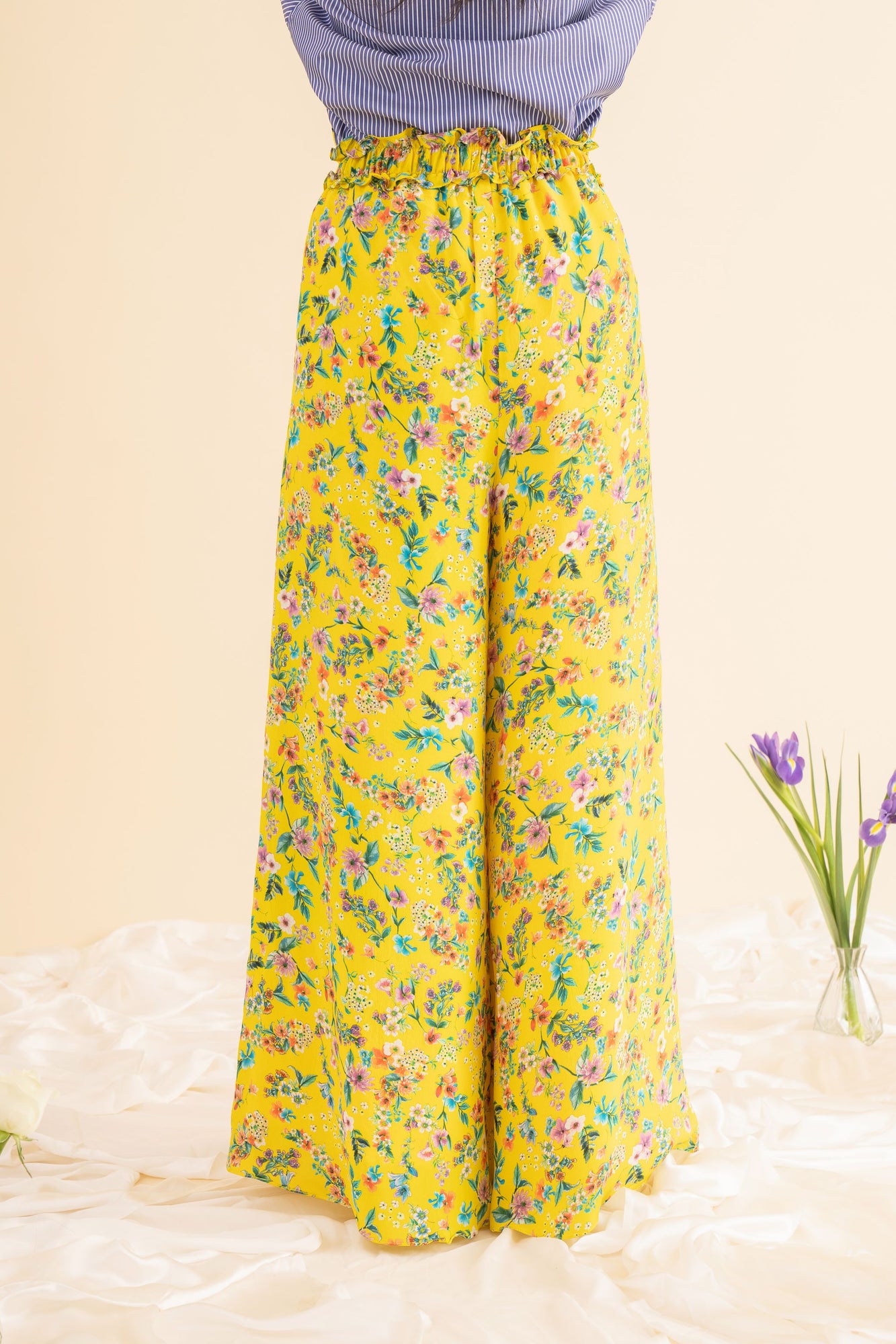 Handcrafted wide-leg palazzo pants in premium fabric, showcasing luxury womenswear with a flowing silhouette and artisan detailing
