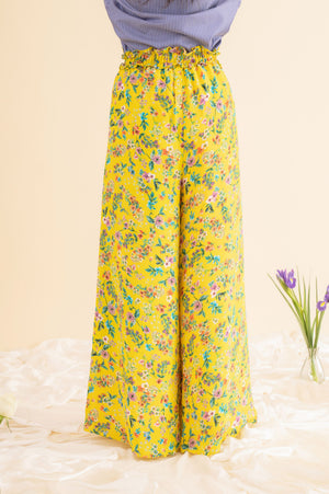 Handcrafted wide-leg palazzo pants in premium fabric, showcasing luxury womenswear with a flowing silhouette and artisan detailing