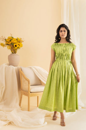 Elegant dragon-pleated dress in rich emerald, showcasing luxurious handloom fabric and exquisite artisan craftsmanship