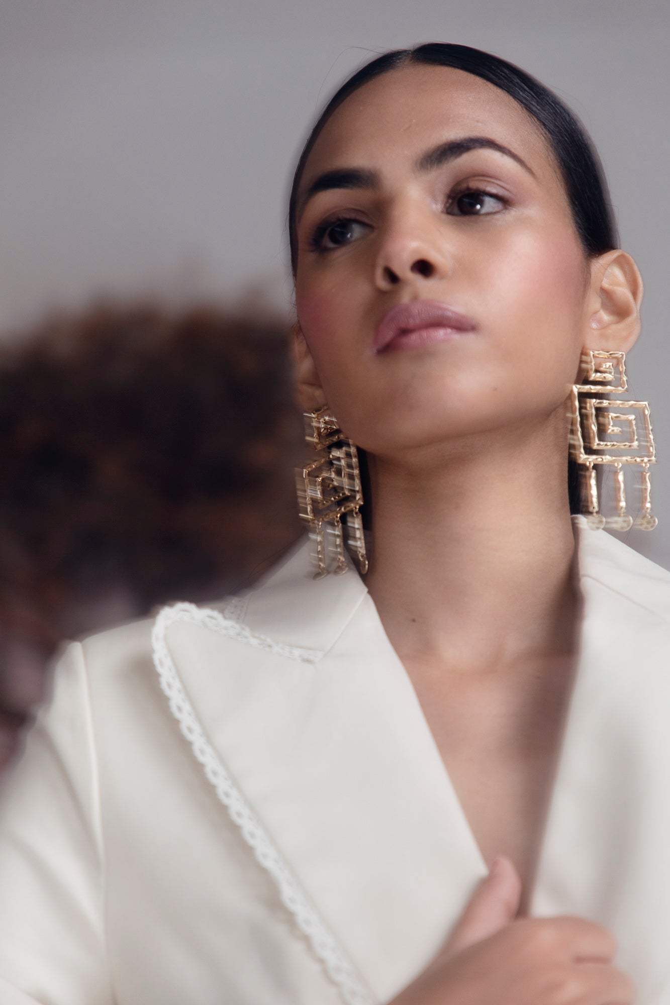 Elegant silver jacket in premium handloom fabric, showcasing a tailored silhouette and exquisite artisan craftsmanship, perfect for luxury womenswear