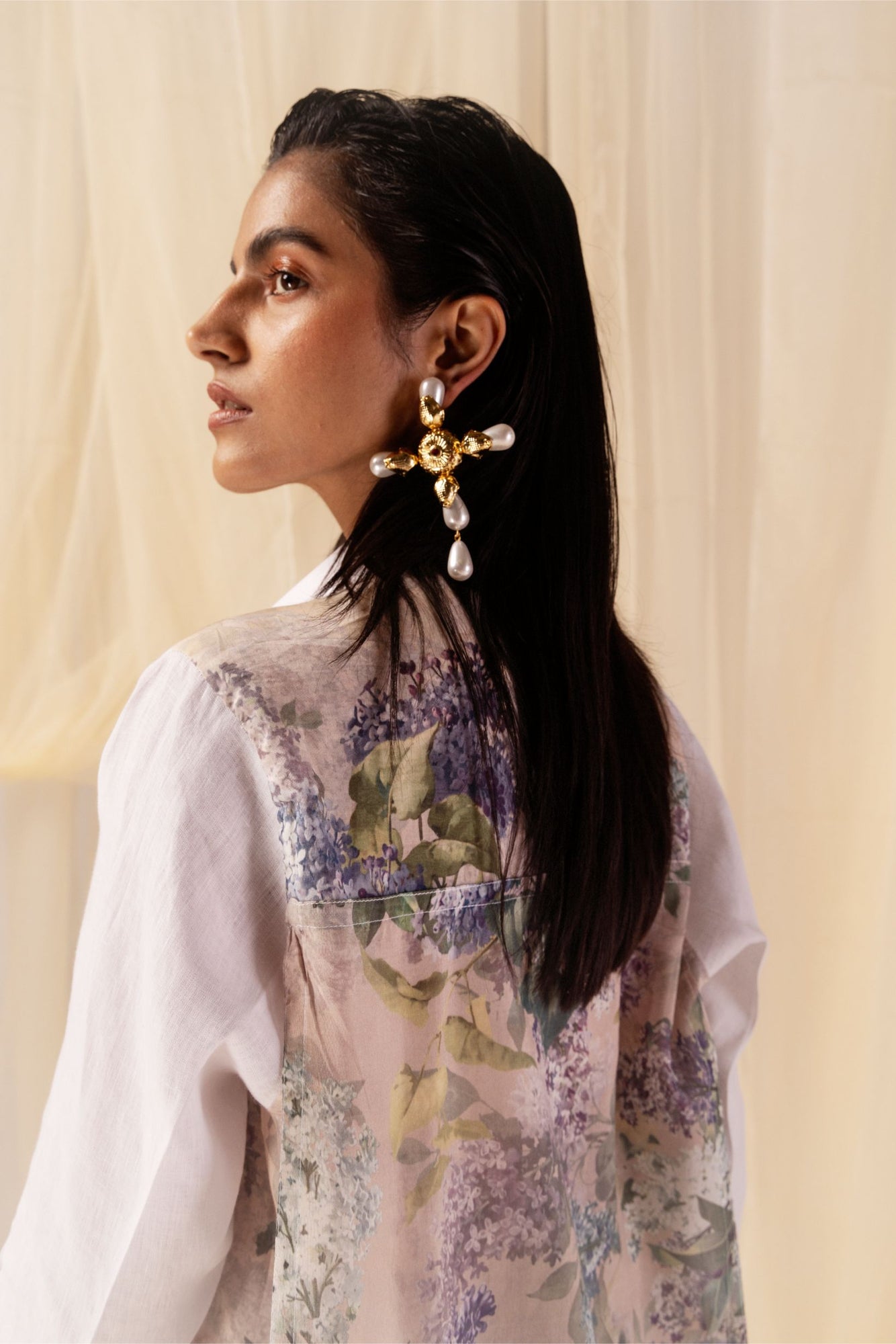 White linen shirt with hydrangea print, paired with relaxed-fit elasticated trousers. Crafted from linen and Chanderi silk for luxury
