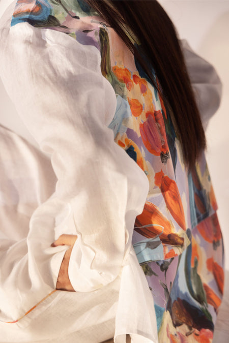 Millefleur Co-ord Set - Close-up of white linen shirt back with colorful floral print, worn with elasticated trousers - NJ3ATELIER co-ord set